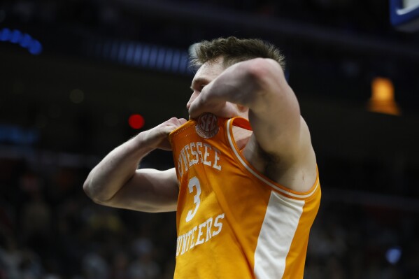 Tennessee guard Dalton Knecht walks off the court atfter the second half of an Elite Eight college basketball game against Purdue in the NCAA Tournament, Sunday, March 31, 2024, in Detroit. (AP Photo/Duane Burleson)