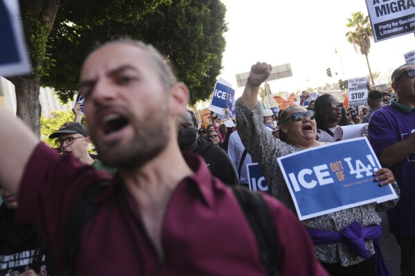 Protesters march after federal immigration authorities conducted an operation on Friday, June 6, 2025, in Los Angeles. (AP Photo/Jae C. Hong)