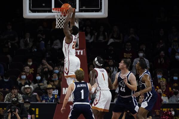 Southern California guard Ethan Anderson (20) dunks the ball during the first half of an NCAA college basketball game against Dixie State in Los Angeles, Monday, Nov. 22, 2021. (AP Photo/Ashley Landis)