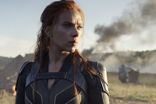 This image released by Disney/Marvel Studios' shows Scarlett Johansson in a scene from "Black Widow." The Walt Disney Co. on Friday overhauled its release schedule, moving the dates of half a dozen Marvel movies. “Black Widow,” which had been set to kick off the summer movie season, will now open Nov. 6. (Marvel Studios/Disney via AP)