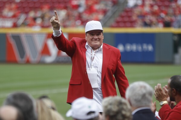 Former Cincinnati Reds player and guest Pete Ross acknowledges spectators during a Cincinnati Reds Hall of Fame induction ceremony before a baseball game against the Pittsburgh Pirates, Saturday, July 21, 2018, in Cincinnati. (AP Photo/John Minchillo, File)