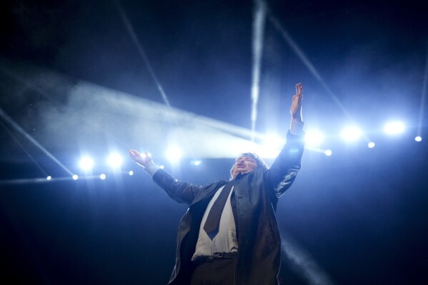 Presidential candidate of the Liberty Advances coalition Javier Milei waves to supporters during a campaign rally in Buenos Aires, Argentina, Wednesday, Oct. 18, 2023. General elections are set for Oct. 22. (AP Photo/Natacha Pisarenko)