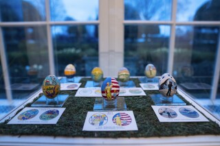 FILE - Eggs designed by children of members of the military adorn the East Colonnade of the White House ahead of the White House Easter Egg Roll, Thursday, March 28, 2024, in Washington. Social media users are misrepresenting the contest for which the eggs were designed, as well as a proclamation about Day of Transgender Visibility. (AP Photo/Evan Vucci, File)