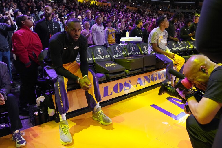Los Angeles Lakers forward LeBron James waits to be introduced prior to an NBA basketball game against the Denver Nuggets Saturday, March 2, 2024, in Los Angeles. (AP Photo/Mark J. Terrill)