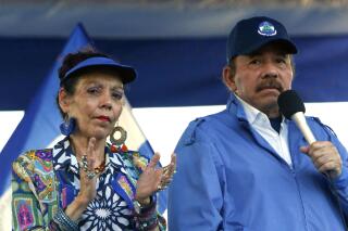 FILE - In this Sept. 5, 2018 file photo, Nicaragua's President Daniel Ortega and his wife, Vice President Rosario Murillo, lead a rally in Managua, Nicaragua. The European Union on Monday, Aug. 2, 2021 slapped sanctions on Nicaraguan first lady and seven other senior officials accused of serious human rights violations or undermining democracy, amid a crackdown on opposition politicians in the Central American country. (AP Photo/Alfredo Zuniga, File)