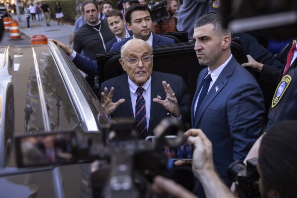 Former New York City Mayor Rudy Giuliani speaks to the members of the media as he leaves court in New York, Thursday, Nov. 7, 2024. (AP Photo/Yuki Iwamura)