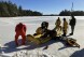 In this photo provided by the Maine Warden Service, rescuers work with an ice rescue raft on a lake in the Maine wilderness where a man crashed into the icy water and drowned, Friday, Dec. 8, 2023, in T3 Indian Township Purchase, Maine. (Maine Warden Service via 鶹ýapp)