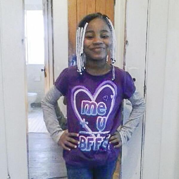 In this undated photo provided by her family, Amaria Jones stands for a photo wearing her favorite color, purple. Gun violence is killing an increasing number of American children, many of them caught in crossfire. When a stray bullet pierced the window of a Chicago home in 2020, it hit and killed 13-year-old Amaria as she danced for her mother. (Jones Family via AP)