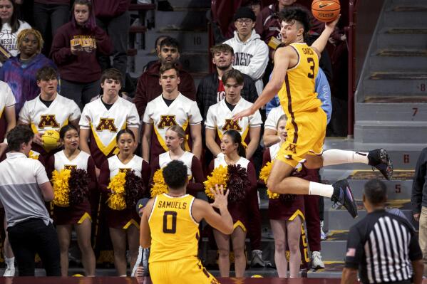 Minnesota's Dawson Garcia (3) saves the ball from going out of bounds during the second half of an NCAA college basketball game against Western Michigan on Monday, Nov. 7, 2022, in Minneapolis. (Carlos Gonzalez/Star Tribune via AP)