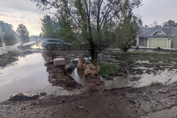 This photograph provided by Stephen McNerney shows mud left behind by flooding around McNerney's home on the outskirts of Flagstaff, Arizona, in mid-July 2022. Flagstaff has been inundated with rain from the annual monsoon, which has worsened flooding in neighborhoods where wildfires burned this spring. (Stephen McNerney via AP)