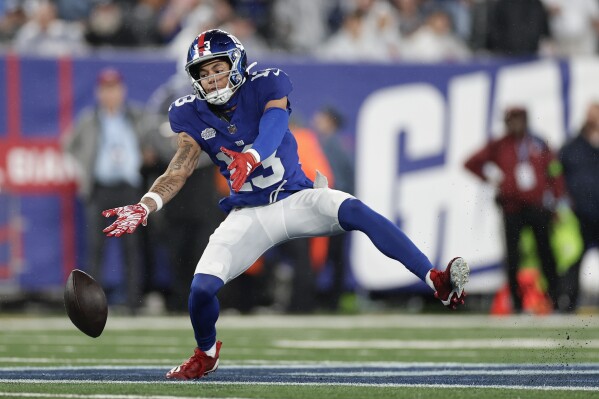 New York Giants' Jalin Hyatt drops a pass during the first half of an NFL football game against the Dallas Cowboys, Sunday, Sept. 10, 2023, in East Rutherford, N.J. (AP Photo/Adam Hunger)