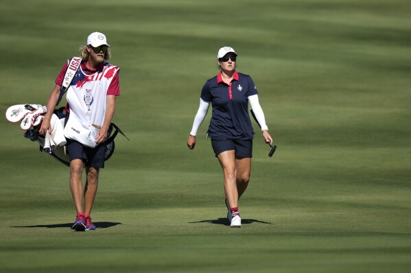 United States' Ally Ewing walks on the 16th hole during her single match at the Solheim Cup golf tournament in Finca Cortesin, near Casares, southern Spain, Sunday, Sept. 24, 2023. Europe play the United States in this biannual women's golf tournament, which played alternately in Europe and the United States. (AP Photo/Bernat Armangue)