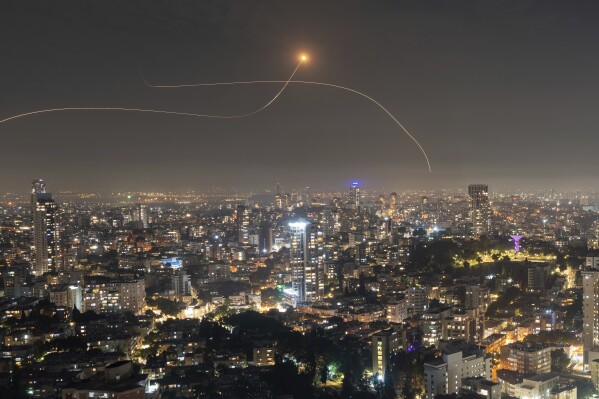 Israeli Iron Dome air defense system fires to intercept a rocket fired from the Gaza Strip, in central Israel, Saturday, Oct. 28, 2023. (AP Photo/Oded Balilty)