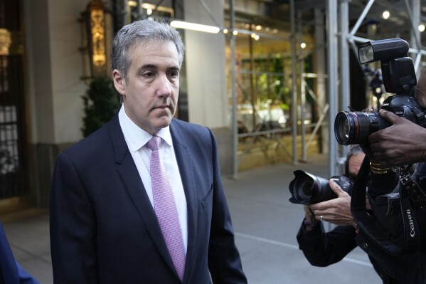 Michael Cohen leaves his apartment building on his way to Manhattan criminal court in New York, Monday, May 20, 2024. (AP Photo/Seth Wenig)