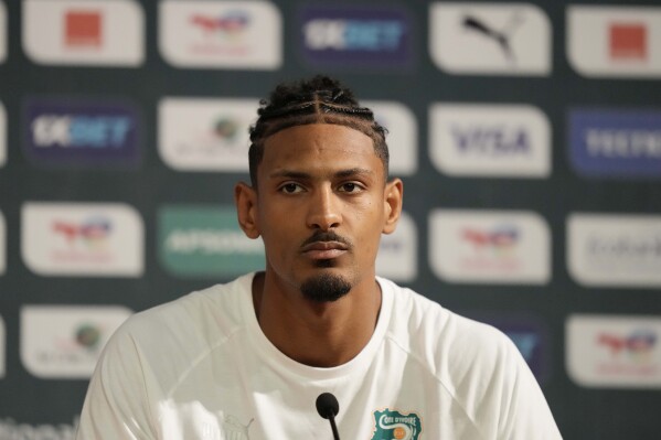 Ivory Coast's Sebastien Haller, listens to questions during a media conference, in Abidjan, Ivory Coast, Saturday, Feb. 10, 2024. Ivory Coast will play the African Cup of Nations soccer Final match against Nigeria on Sunday, Feb. 11, 2024. (AP Photo/Sunday Alamba)