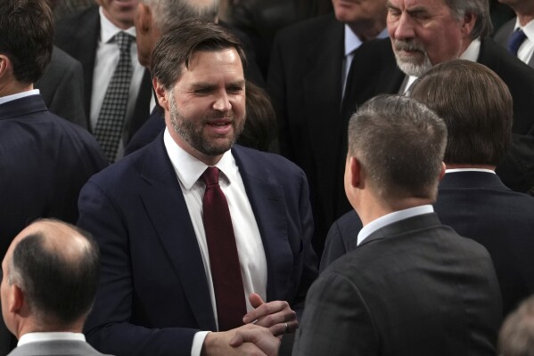 Vice President-elect JD Vance is congratulated after a joint session of Congress confirmed the Electoral College votes, affirming President-elect Donald Trump's victory in the presidential election, Monday, Jan. 6, 2025, at the U.S. Capitol in Washington. (AP Photo/Matt Rourke)