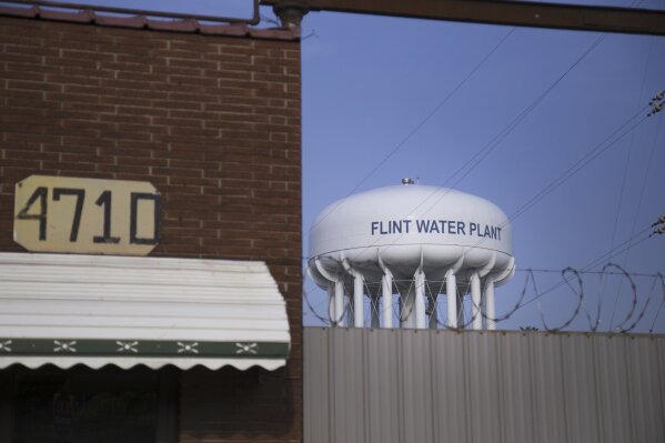 FILE - The sun sets on the Flint Water Plant on the northeast side of Flint, Mich., June 14, 2017. The state of Michigan said it's willing to step in and oversee property repairs at 1,900 homes in Flint where water pipes have been inspected or replaced but the grounds remain a mess. In March 2024, the city was found in civil contempt by a judge after blowing past deadlines to get the work done, years after a water switch in Flint in 2014 caused lead to leach off old pipes, spoiling the drinking water system. (Shannon Millard/The Flint Journal via AP, File)