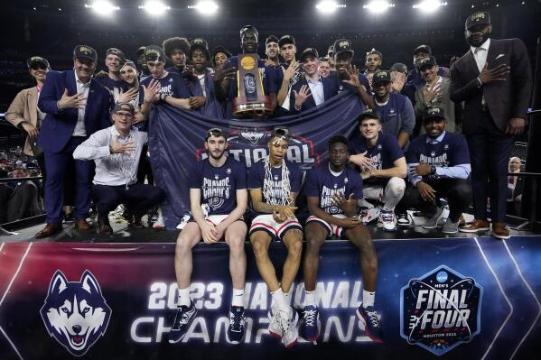 Connecticut pose after their win against San Diego State during he men's national championship college basketball game in the NCAA Tournament on Monday, April 3, 2023, in Houston. (AP Photo/David J. Phillip)