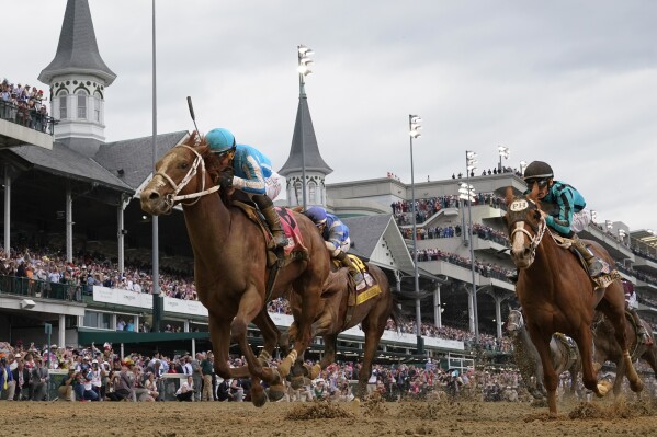 FILE - Mage (8), with Javier Castellano aboard, wins the 149th running of the Kentucky Derby horse race at Churchill Downs Saturday, May 6, 2023, in Louisville, Ky. Kentucky Derby winner Mage and Belmont Stakes winner Arcangelo head a full field of 14 horses for the wide-open Breeders' Cup Classic. (AP Photo/Jeff Roberson, File)