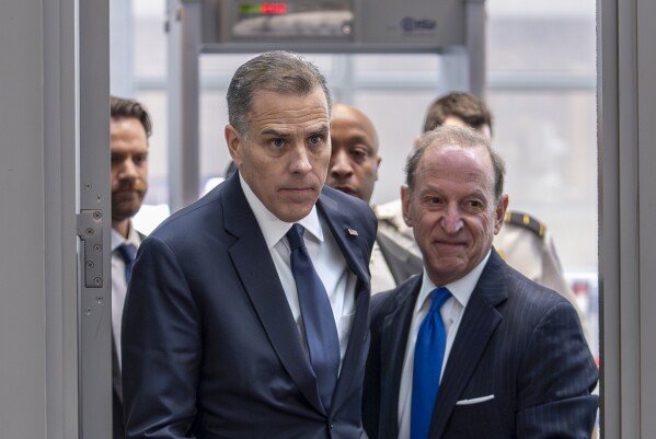 Hunter Biden, left, son of President Joe Biden, arrives with attorney Abbe Lowell at the O'Neill House Office Building for a closed-door deposition in a Republican-led investigation into the Biden family, on Capitol Hill in Washington, Wednesday, Feb. 28, 2024. Lawmakers from the House Oversight and Accountability Committee and the House Judiciary Committee are conducting the inquiry. (AP Photo/J. Scott Applewhite)