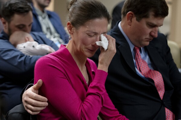 Rebecca Milner, a plaintiff in the Nicole Blackmon vs. the State of Tennessee, wipes away tears as she listens to arguments presented by her attorney in court Thursday, April 4, 2024, in Nashville, Tenn. The case challenges the medical necessity exception to Tennessee's total abortion ban. (AP Photo/George Walker IV)