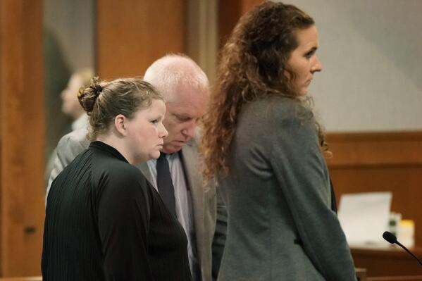 Jessica Trefethen, left, listens as the jury announces their verdict in Waldo County Superior Court in Belfast, Maine, on Tuesday, Oct. 18, 2022. Trefethen was found guilty of depraved indifference murder in the 2021 death of her 3-year-old son Maddox Williams. With Trefethen are her attorneys Jeff Toothaker and Caitlyn Smith. (Gregory Rec/Portland Press Herald via AP)