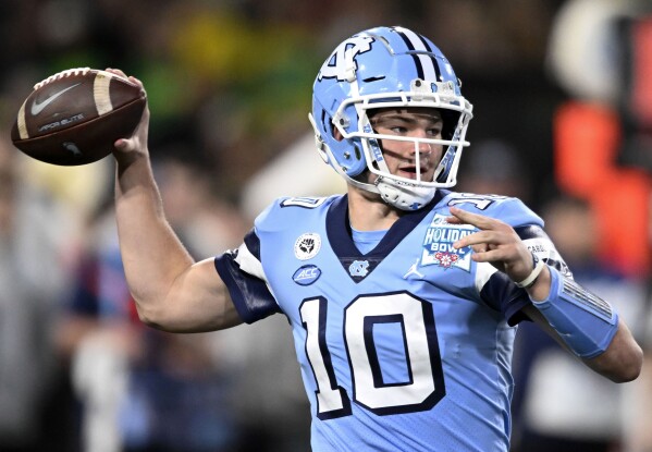 FILE - North Carolina quarterback Drake Maye looks to pass during the first half of the Holiday Bowl NCAA college football game against Oregon, Dec. 28, 2022, in San Diego. Maye and the Tar Heels have an interesting early schedule that includes South Carolina, Appalachian State and then this clash with the Golden Gophers. (AP Photo/Denis Poroy, File)