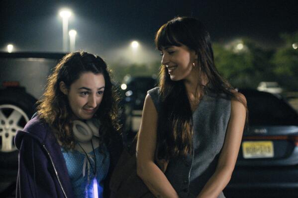This image released by Apple TV+ shows Vanessa Burghardt, left, and Dakota Johnson in "Cha Cha Real Smooth," premiering June 17, 2022. (Apple TV+ via AP)