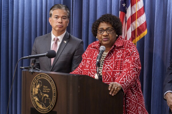 California Attorney General Rob Bonta, left, Secretary of State Shirley Weber takes questions after announcing a lawsuit to protect voter rights at a news conference at the California Department of Justice in Los Angeles Monday, April. 15, 2024. (AP Photo/Damian Dovarganes)