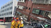 In this photo released by the National Fire Agency, members of a search and rescue team prepare outside a leaning building in the aftermath of an earthquake in Hualien, eastern Taiwan on Wednesday, April 3, 2024. Taiwan's strongest earthquake in a quarter century rocked the island during the morning rush Wednesday, damaging buildings and creating a tsunami that washed ashore on southern Japanese islands. (National Fire Agency via AP)