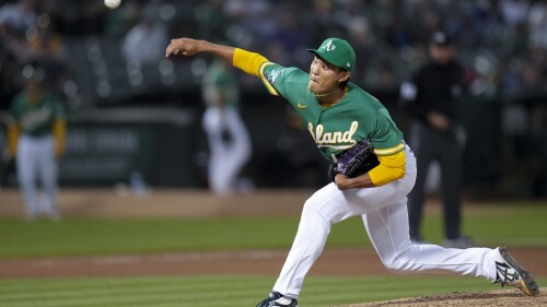 Oakland Athletics pitcher Shintaro Fujinami throws to a Boston Red Sox batter during the seventh inning of a baseball game Tuesday, July 18, 2023, in Oakland, Calif. (AP Photo/Godofredo A. Vásquez)