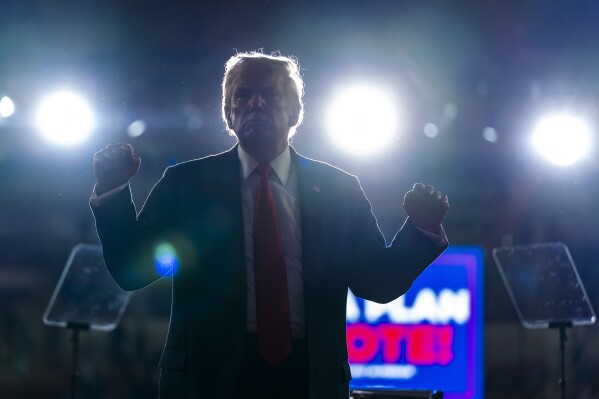 Republican presidential candidate former President Donald Trump pumps his fists after speaking at a campaign rally, Wednesday, July 31, 2024, in Harrisburg, Pa. (AP Photo/Alex Brandon)