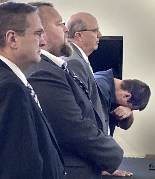 CORRECTS TO THOMAS, NOT TOM - Defendant Eric Molitor breaks down after hearing the jury verdict of not guilty in the trial tied to the plot to kidnap Michigan Gov. Gretchen Whitmer, in Bellaire, Mich., on Friday, Sept. 15, 2023. From left are defense attorney Thomas Siver with his client, defendant Michael Null, and defense attorney William Barnett with his client, Molitor. A jury acquitted three men in the last trial connected to a plan to kidnap Michigan Gov. Gretchen Whitmer, a scheme that was portrayed as an example of homegrown terrorism on the eve of the 2020 presidential election. (Mardi Link/Traverse City Record-Eagle via AP)