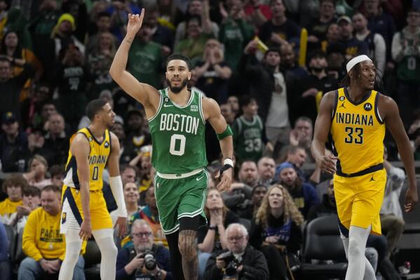 Boston Celtics forward Jayson Tatum (0) gestures after scoring in overtime of the team's NBA basketball game against the Indiana Pacers in Indianapolis, Thursday, Feb. 23, 2023. The Celtics won 142-138. (AP Photo/AJ Mast)
