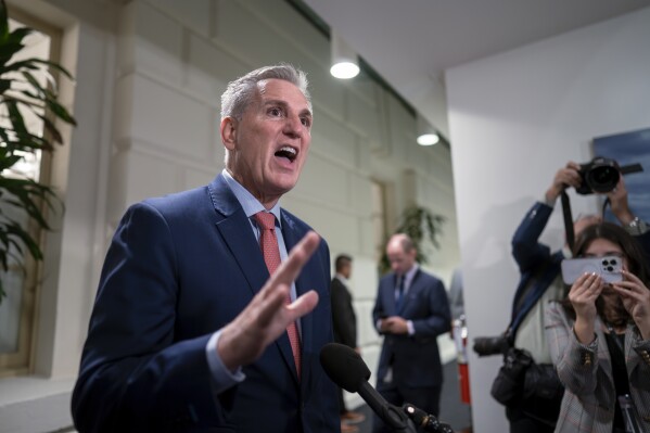 Following a closed-door Republican strategy session, Speaker of the House Kevin McCarthy, R-Calif., talks to reporters about funding the government and averting a shutdown, at the Capitol in Washington, Wednesday, Sept. 27, 2023. (AP Photo/J. Scott Applewhite)