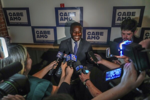 Gabe Amo meets with members of the press at an election results party after his win in the Democratic primary for Rhode Island's 1st Congressional District, Tuesday, Sept. 5, 2023, in Pawtucket, R.I. (David Delpoio/Providence Journal via AP)
