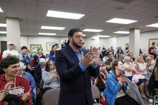 Mark Lee Dickson, a Texas pastor and anti-abortion activist, claps as members of the city council voted to approve an ordinance that would ban the mailing or shipping of abortion pills Tuesday, May 2, 2023 in Danville, Ill. The Illinois city near its eastern border with Indiana on Tuesday banned the mailing or shipping of abortion pills, defying the state's Democratic attorney general and the American Civil Liberties Union who have repeatedly warned that the move violates Illinois law's protection of abortion as a fundamental right. (Armando L. Sanchez/Chicago Tribune via AP)