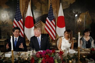 
              President Donald Trump and first lady Melania Trump host Japanese Prime Minister Shinzo Abe and his wife Akie Abe for dinner at Trump's private Mar-a-Lago club, Wednesday, April 18, 2018, in Palm Beach, Fla. (AP Photo/Pablo Martinez Monsivais)
            