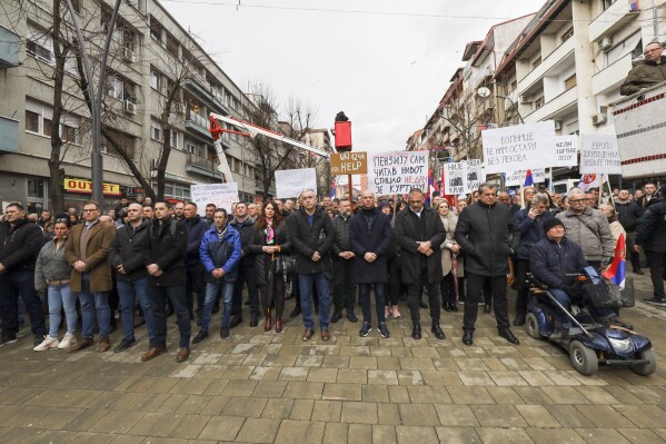 Kosovo Serbs protest against a ban of the use of the Serbian currency in areas where they live, in the northern part of Kosovska Mitrovica, Kosovo, Monday, Feb. 12, 2024. Thousands of minority Serbs in Kosovo on Monday protested a ban of the use of the Serbian currency in areas where they live, an issue that has been the cause of the latest crisis in relations between Serbia and Kosovo. (AP Photo/Bojan Slavkovic)