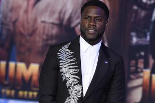 FILE - In this Dec. 9, 2019, file photo, Kevin Hart poses for photographers at the premiere of "Jumanji: The Next Level," in Los Angeles. Hart is bringing more of his funny back to SiriusXM. The satellite radio company announced, Tuesday, Sept. 22, 2020, a new multi-platform deal with Hart and his comedy network Laugh Out Loud. (Photo by Jordan Strauss/Invision/AP, File)