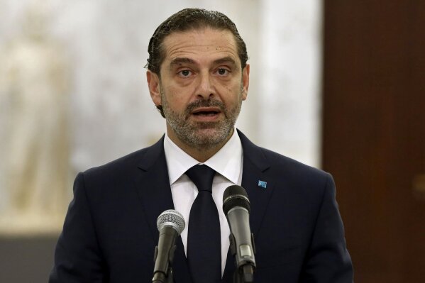 In this photo released by Lebanese government, Lebanese Prime Minister-Designate Saad Hariri, speaks to journalists after his meeting with Lebanese President Michel Aoun, at the Presidential Palace in Baabda, east of Beirut, Lebanon, Monday, March. 22, 2021. Talks on the formation of a new Cabinet in Lebanon collapsed Monday, heralding more economic and financial collapse for the small Arab country. (Dalati Nohra/Lebanese Official Government via AP)