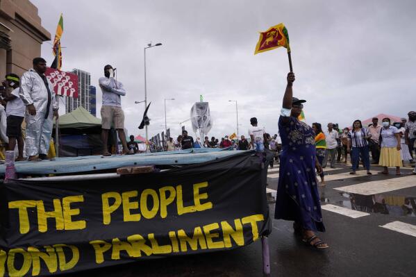 Sri Lankans protest demanding president Gotabaya Rajakasa resign and decrying the appointment of Prime Minister Ranil Wickeremesinghe in Colombo, Sri Lanka, Friday, May 13, 2022. Five-time former Sri Lankan Prime Minister Wickremesinghe was reappointed on Thursday in an effort to bring stability to the island nation, which is engulfed in a political and economic crisis. (AP Photo/Eranga Jayawardena)