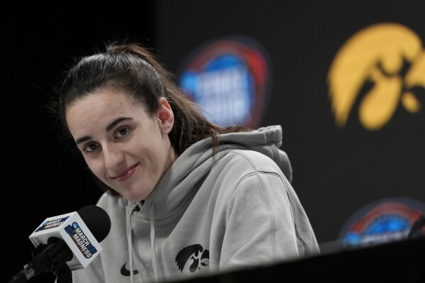 Iowa's Caitlin Clark pauses as she speaks during a press conference before practice for the NCAA Women's Final Four championship basketball game on Saturday, April 6, 2024, in Cleveland. (AP Photo/Carolyn Kaster)