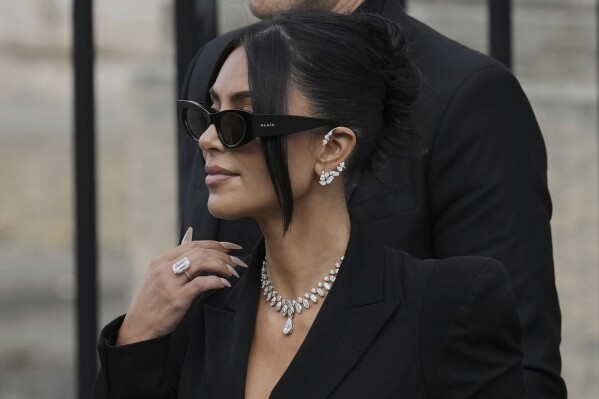 Kim Kardashian leaves the justice palace after testifying, regarding a robbery of millions of dollars in jewels from her Paris hotel room in 2016, in Paris, Tuesday, May 13, 2025. (AP Photo/Aurelien Morissard)