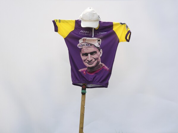 A jersey depicting Raymond Poulidor is seen on the side of the road during the stage departing Saint-Leonard-de-Noblat, the home of cycling legend Raymond Poulidor, during the ninth stage of the Tour de France cycling race over 182.5 kilometers (113.5 miles) with start in Saint-Leonard-de-Noblat and finish in Puy de Dome, France, Sunday, July 9, 2023. (AP Photo/Thibault Camus)