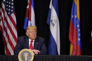 President Donald Trump listens during a roundtable on Venezuela at Iglesia Doral Jesus Worship Center, Friday, July 10, 2020, in Doral, Fla. (AP Photo/Evan Vucci)