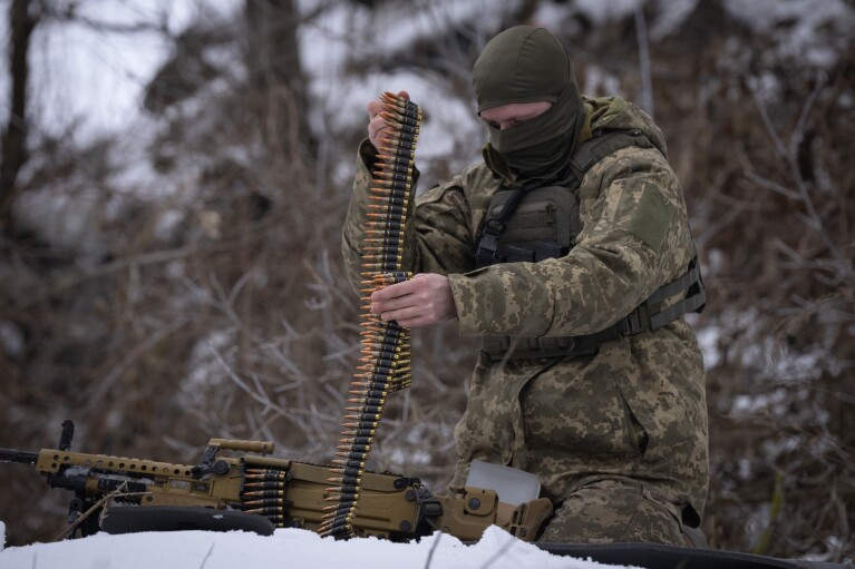A member of the pro-Ukrainian Russian ethnic Siberian battalion exercises at a military training ground near Kiev, Ukraine, Wednesday, Dec. 13, 2023.  The Ukrainian military has created a battalion of soldiers composed entirely of Russian citizens who want to fight against the Russian invasion.  (AP Photo/Efrem Lukatsky)