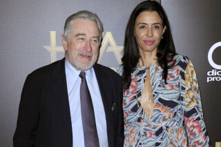 FILE - Robert De Niro, left, and his daughter Drena De Niro appear at the 20th annual Hollywood Film Awards in Beverly Hills, Calif., on Nov. 6, 2016. Leandro De Niro Rodriguez, a grandson of Robert De Niro and Diahnne Abbott, has died at 19. His mother, Drena De Niro, announced the news Monday in an Instagram post. (Photo by Richard Shotwell/Invision/AP, File)