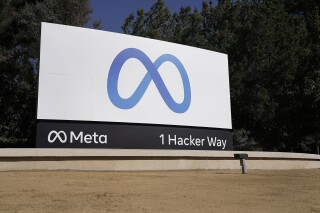 FILE - Facebook's Meta logo sign is seen at the company headquarters in Menlo Park, Calif., Oct. 28, 2021. Meta reports earnings on Wednesday, Oct. 25, 2023. (AP Photo/Tony Avelar, File)