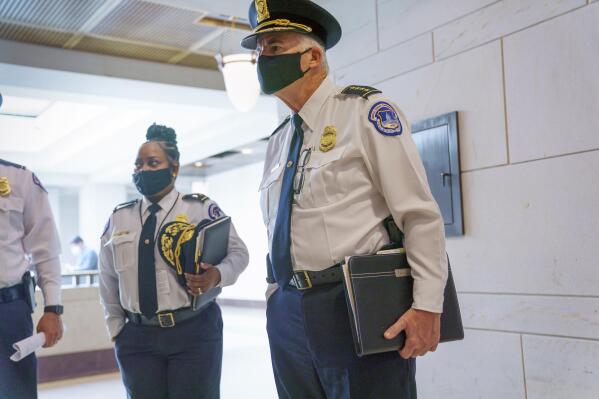 U.S. Capitol Police Chief Thomas Manger, joined at left by Assistant Chief Yogananda Pittman, heads to a closed-door meeting with congressional leaders for a briefing as security officials prepare for a Sept. 18 demonstration by supporters of the people arrested in the Jan. 6 riot, at the Capitol in Washington, Monday, Sept. 13, 2021. (AP Photo/J. Scott Applewhite)